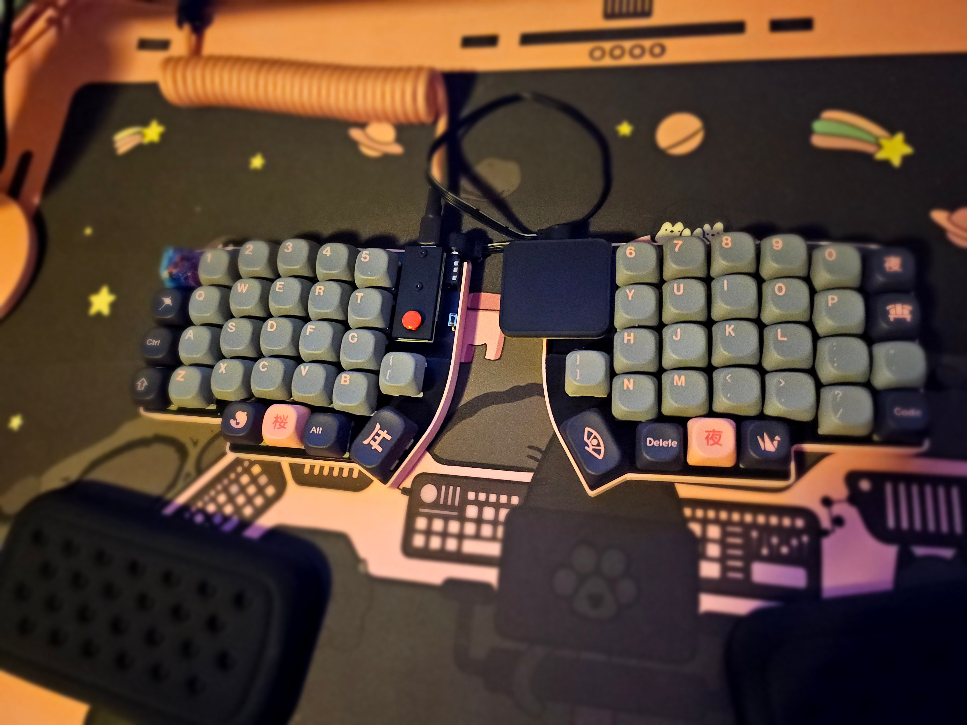 Lily58 with trackpad on space-themed desk mat