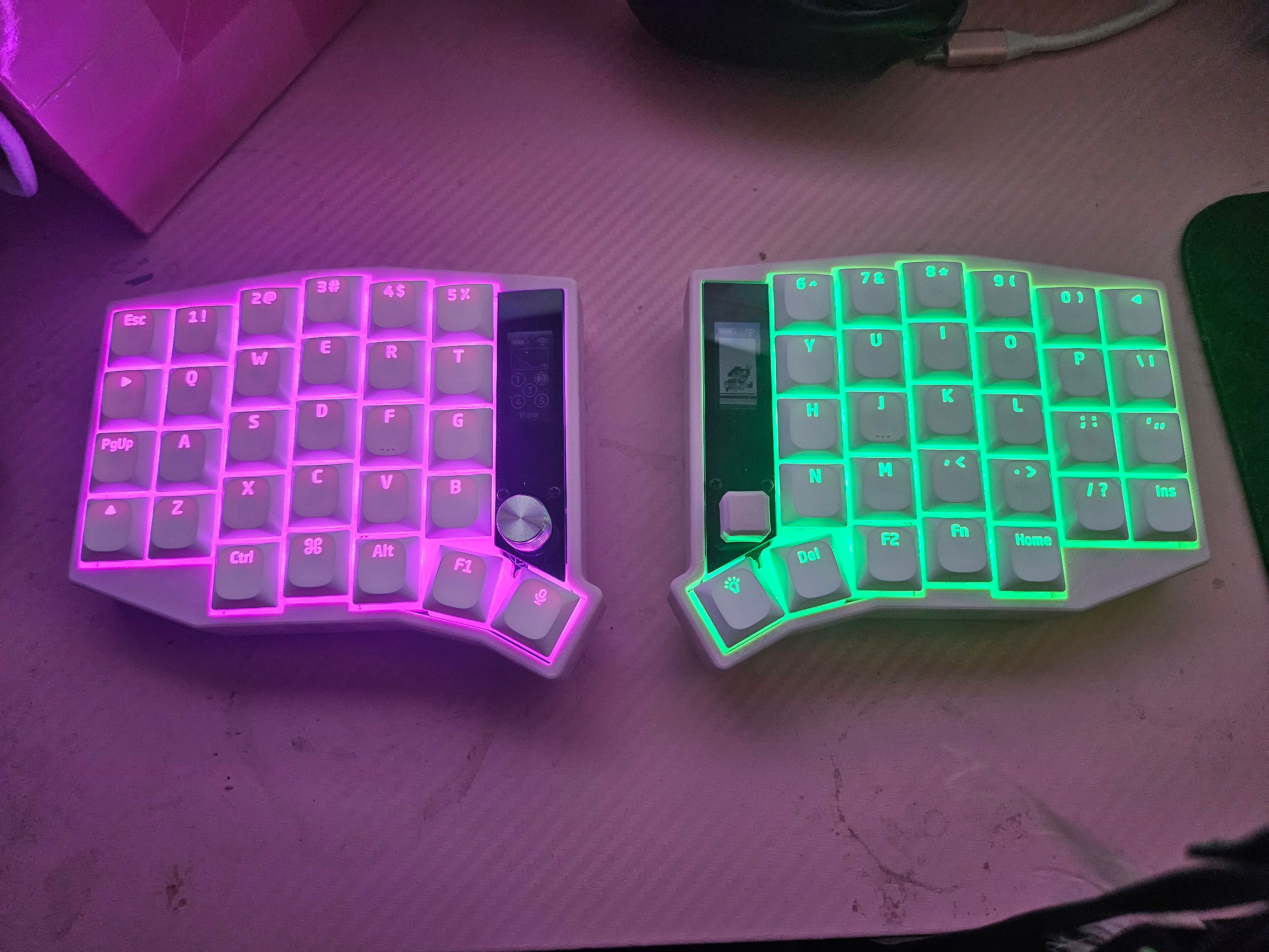 Sofle keyboard with pink case and OLED displays My Sofle with ZMK and OLED screens